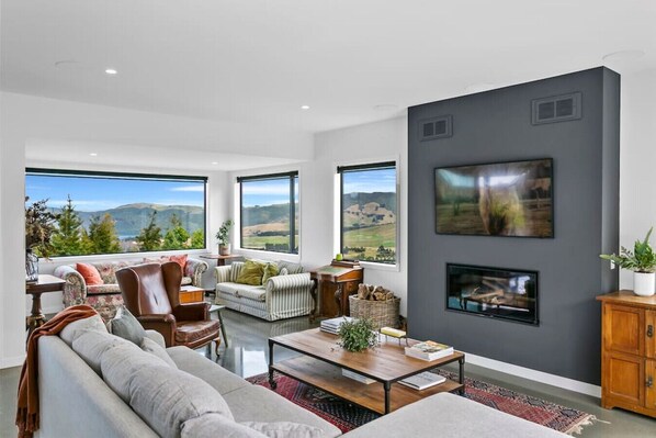 TV, fireplace - Peaceful Luxury Retreat - with Spa Pool, a spacious, beautiful, private property with stunning views (Taupō)