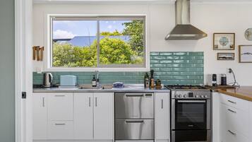 Fridge, stovetop, dishwasher, coffee/tea maker