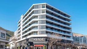 A multi-story building with a modern design, featuring balconies and large windows. - Luxurious Sea Point Studio Apartment (Cape Town)