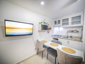 Fridge, microwave, stovetop, coffee/tea maker