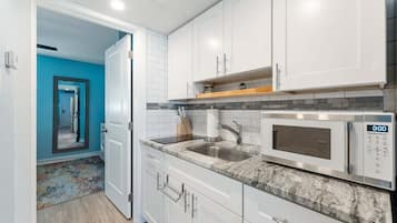 Fridge, microwave, stovetop, coffee/tea maker