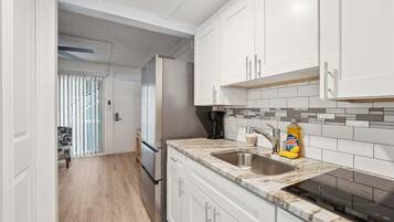 Fridge, microwave, stovetop, coffee/tea maker