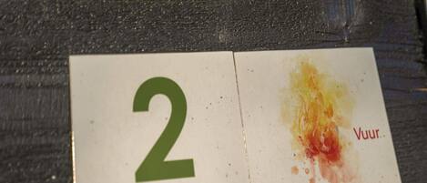 A card with the number 2 and text 'Groene Camping In de polder' and 'Groene Camping In de polder'.