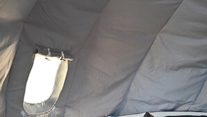 A tent interior with a window and a zipper. - Sky Pod #2/Tree Tent 2 (Dunlap)