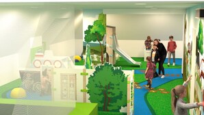 Un espace de jeux pour enfants avec un toboggan, une piscine à balles et un mur interactif.