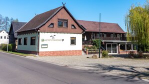 A building with a sign reading 'GASTHOF STORCHENNEST.'