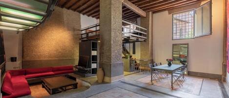 Apartment (2 Bedrooms) | Living area | 32-inch Smart TV with cable channels