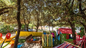 A playground with a slide, sandpit, and playhouse. - Amazing apartment in Mandre with WiFi (Mandre)