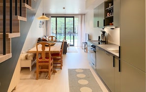 Fridge, stovetop, dishwasher, coffee/tea maker