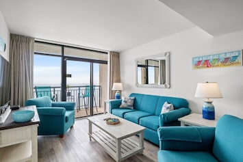 This gorgeous oceanfront living room is the perfect beach escape. This spacious condo sleeps 8 comfortably. It features a direct oceanfront balcony, accessible from both the living room and main bedroom. Seats 8 comfortably and sleeps 2 at night.