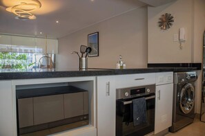 Stovetop, coffee/tea maker, toaster, cookware/dishes/utensils