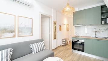 Loft standard | Área de estar | Smart TV 40 polegadas com canais a cabo