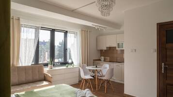 Deluxe Studio Suite, Balcony, City View | Iron/ironing board, free WiFi