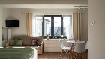 Deluxe Studio Suite, Balcony, City View | Iron/ironing board, free WiFi