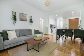 Basic Apartment, 2 Bedrooms, Kitchen, City View | Living area | 42-inch Smart TV with cable channels, streaming services