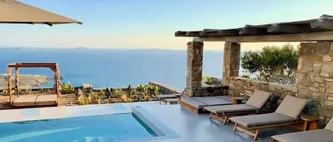 Outdoor pool, open 8:00 AM to 8:00 PM, pool umbrellas, sun loungers