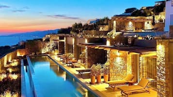 Outdoor pool, open 8:00 AM to 8:00 PM, pool umbrellas, sun loungers