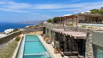 Outdoor pool, open 8:00 AM to 8:00 PM, pool umbrellas, pool loungers