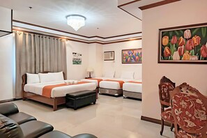 A hotel room with two beds, a desk, a chair, and a large window with curtains. - Ferrymar Hotel Iloilo (Iloilo)