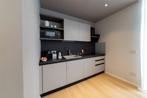 Fridge, microwave, stovetop, coffee/tea maker