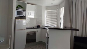 Fridge, microwave, oven, stovetop - **Luxury Ocean-View Retreat in the Heart of Mooloolaba** (Sunshine Coast)