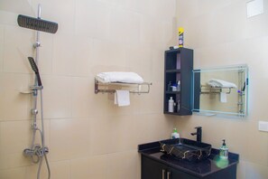 Shower, designer toiletries, hair dryer, bathrobes