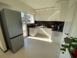 Appartement | Cuisine privée | Chaise haute