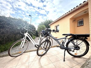 Guests can enjoy a relaxing outdoor space with a bicycle parked nearby.