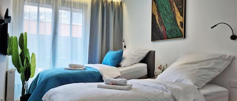 4 bedrooms, desk, iron/ironing board, travel cot