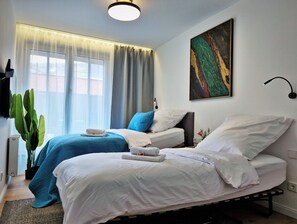 4 bedrooms, desk, iron/ironing board, travel cot