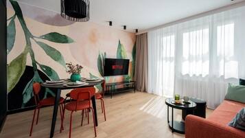 Superior Apartment, City View | Living area | 50-inch Smart TV with cable channels, Netflix, streaming services