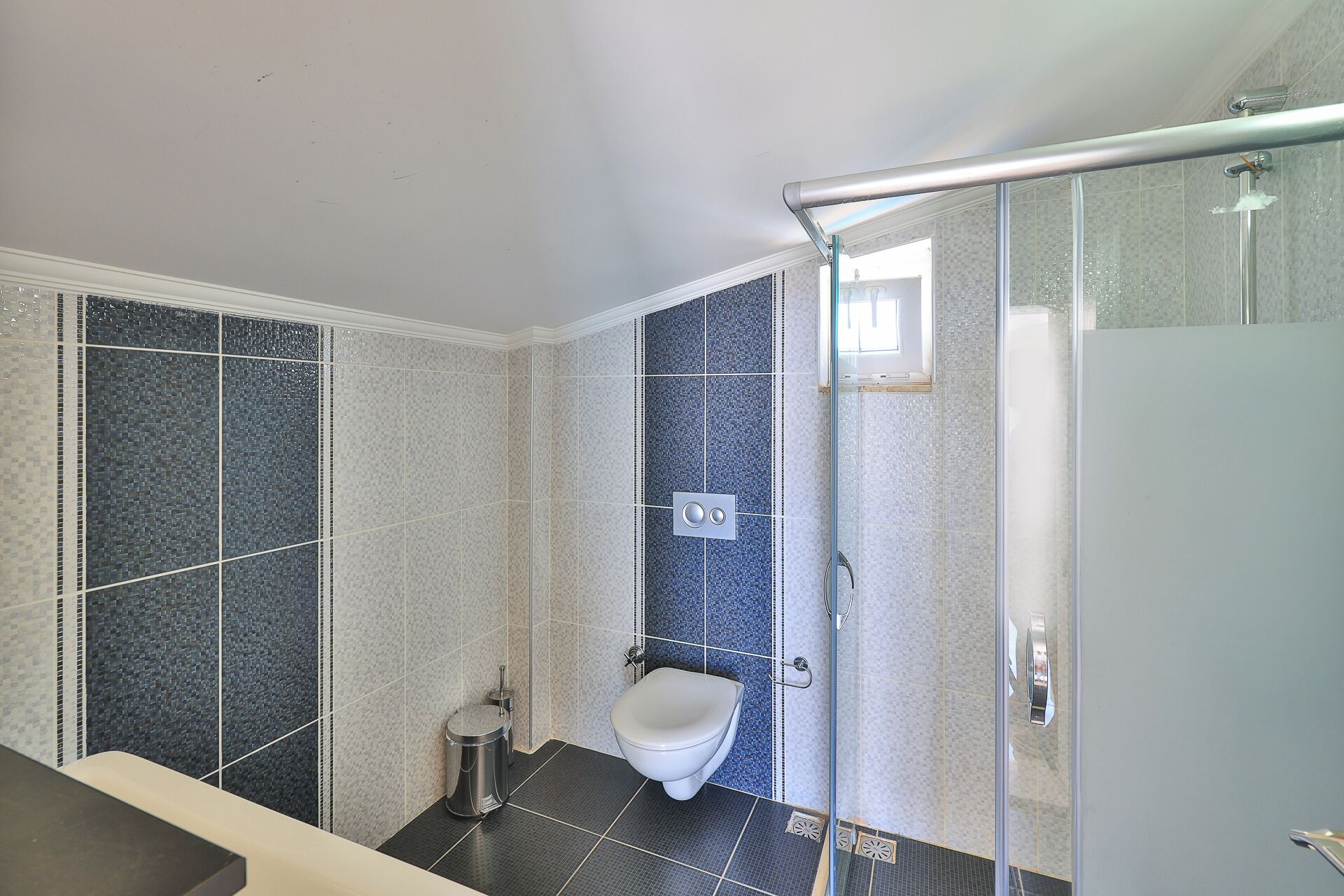 Shower, hair dryer, slippers, towels