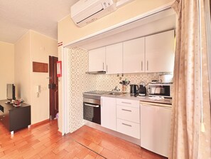 Microwave, coffee/tea maker, cookware/dishes/utensils