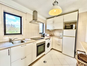 Microwave, coffee/tea maker, cookware/dishes/utensils