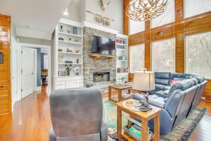 TV, fireplace, books