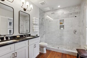 Shower, hair dryer, towels, shampoo