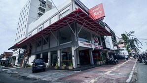 A hotel named 'Hotel Losari' with a modern facade, a covered entrance, and a visible staircase leading to the upper floors. - Losari Roxy Hotel Jakarta (Jakarta)