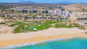 A coastal resort with multiple buildings, a golf course, and a beach. - Luxury Cabo Del Sol Oceanfront Villa w/ Infinity Pool, Walk to Beach & Golf View (Corridor)