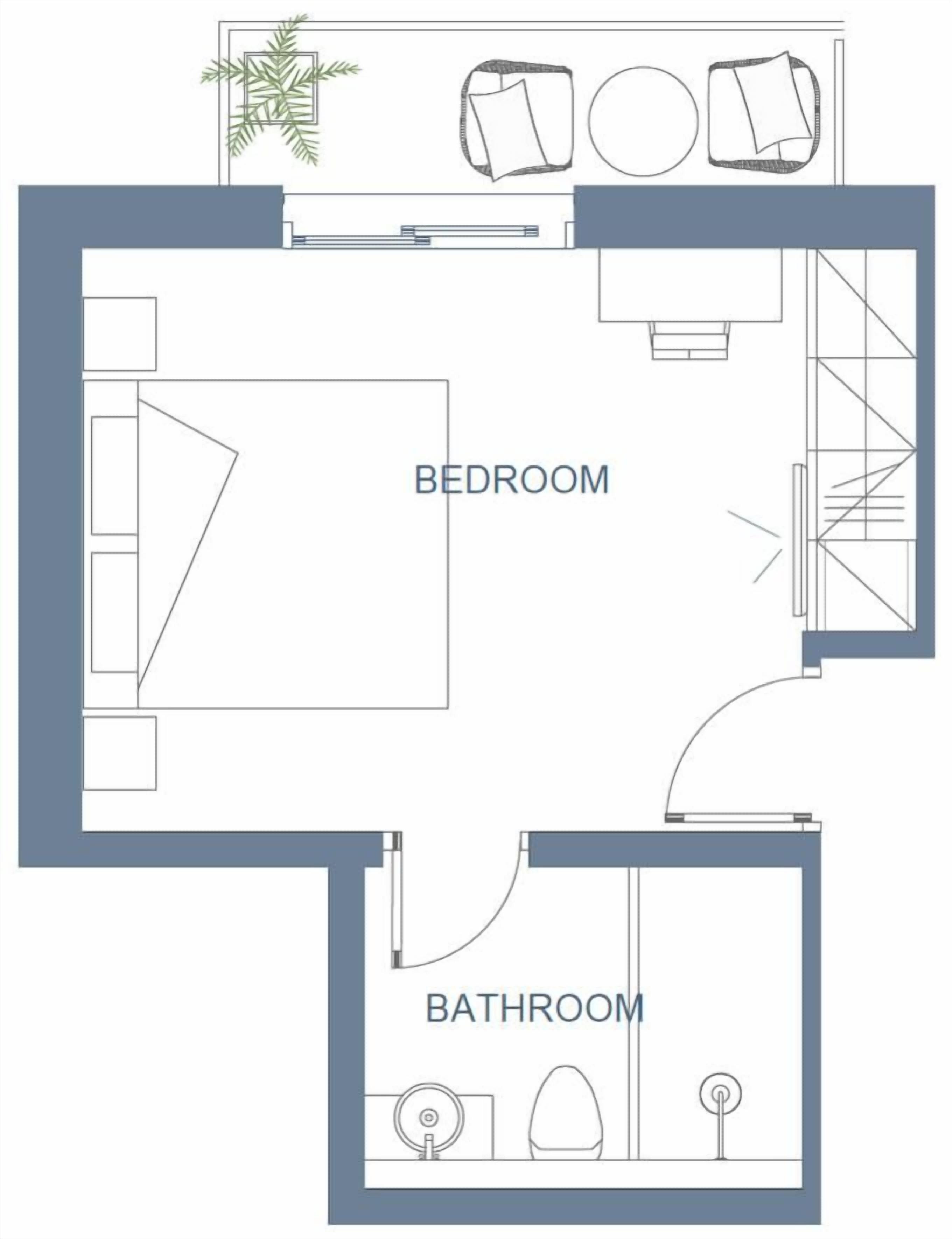 A floor plan with a bedroom, bathroom, and kitchenette area.