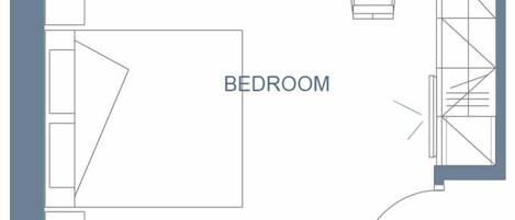 A floor plan with a bedroom, bathroom, and kitchenette area.