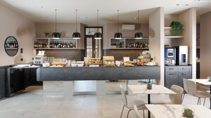 A modern bar area with a marble counter, multiple seating options, and a variety of beverages and snacks. - Hotel Stelvio Tirano (Tirano)
