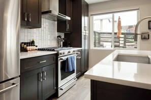 Fridge, microwave, oven, stovetop - Modern Getaway - Rooftop Mtn Views - Near Regis (Denver)