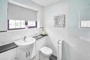 Shower, hair dryer, towels, shampoo