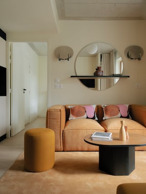 Two-Bedroom Apartment | Living area | 50-inch flat-screen TV with satellite channels, Netflix