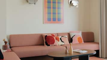 Four-Bedroom Penthouse Apartment | Living area | 50-inch flat-screen TV with satellite channels, Netflix