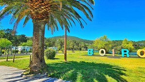 A park with the word "BOIRO" spelled out in large letters, surrounded by greenery and a clear blue sky. - SeaView Boiro Apartment 2 Bed (Boiro)