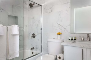 Shower, hair dryer, towels, shampoo