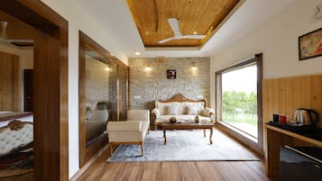 Habitació Deluxe | Sala d'estar | Llar de foc, terres tèrmics i impressores