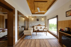 Premium Chalet with Bath-Tub | Living area | Fireplace, heated floors, printers