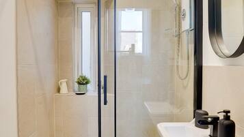 Shower, hair dryer, towels, soap